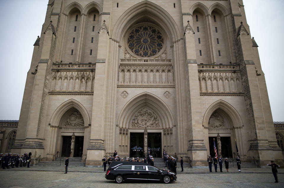 The hearse carrying the casket of former President George H.W. Bush arrives at the National Cathedral during a state funeral service in Washington, D.C., on Wednesday, Dec. 5, 2018. (Photo: Al Drago/Bloomberg via Getty Images)