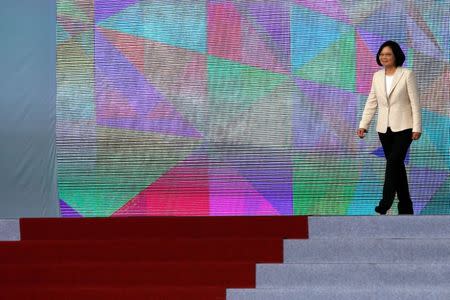 FILE PHOTO: Taiwan President Tsai Ing-wen walks on the podium before addressing during an inauguration ceremony in Taipei, Taiwan May 20, 2016. REUTERS/Tyrone Siu/File Photo