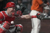 Philadelphia Phillies catcher Andrew Knapp is hit on the face mask by a pitch during the sixth inning of the team's baseball game against the San Francisco Giants on Friday, June 18, 2021, in San Francisco. (AP Photo/Tony Avelar)