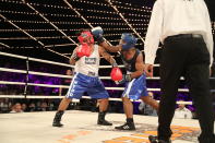 <p>John Chalen (red) battles Reshawn Merrick (blue) in the Bronx Precinct Callout during the NYPD Boxing Championships at the Hulu Theater at Madison Square Garden on March 15, 2018. (Gordon Donovan/Yahoo News) </p>