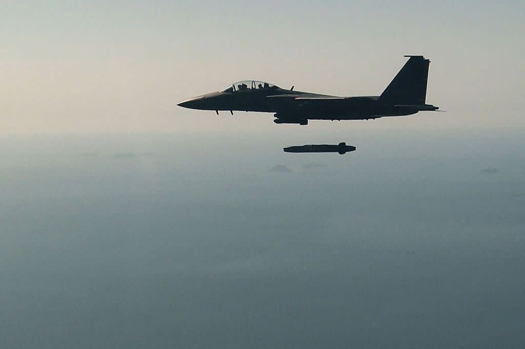 A South Korean Air Force F-15K fighter jet flying with a Taurus long-range air-to-surface missile during an exercise in Taean-gun, South Korea on Sept. 12, 2017. (South Korean Defense Ministry via Getty Images)