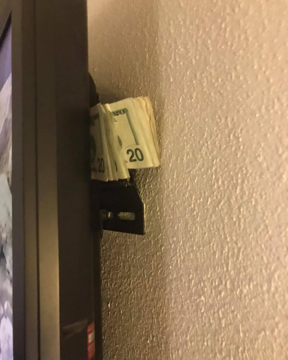 US cash hidden behind a TV in a hotel room. 