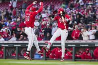 Cincinnati Reds' Will Benson, left, celebrates with Elly De La Cruz after hitting a solo home run against the Philadelphia Phillies during the third inning of a baseball game in Cincinnati, Wednesday, April 24, 2024. (AP Photo/Aaron Doster)