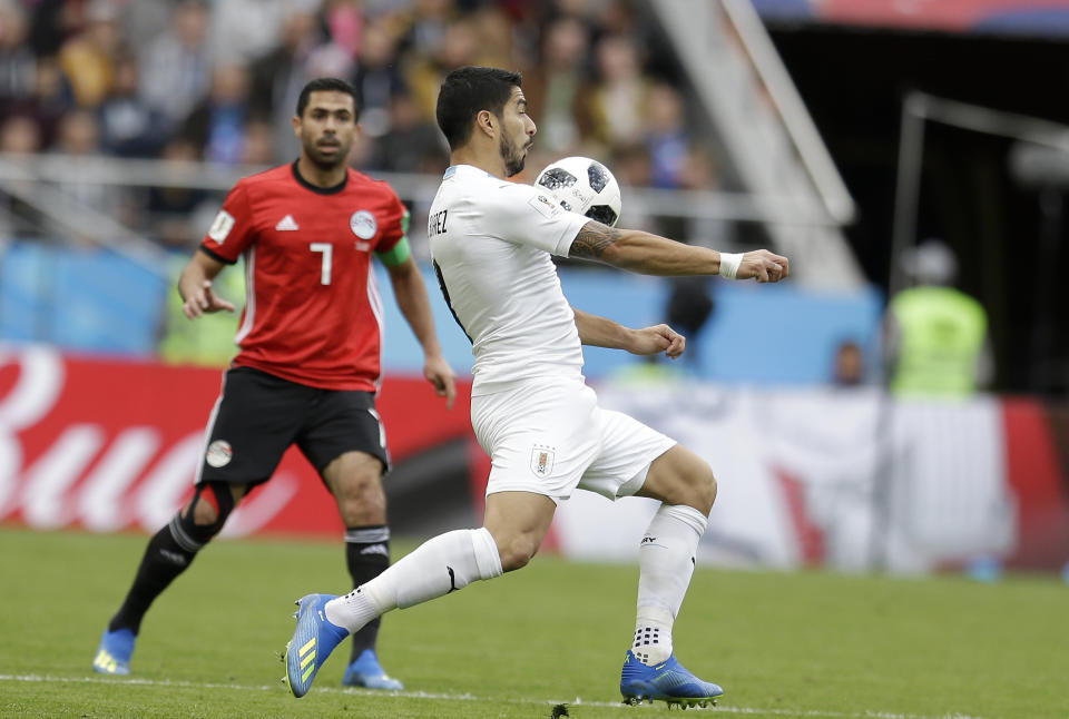 <p>Uruguay’s Luis Suarez is in control against Egypt but it wasn’t a first half to remember for the Barcelona striker. (AP) </p>