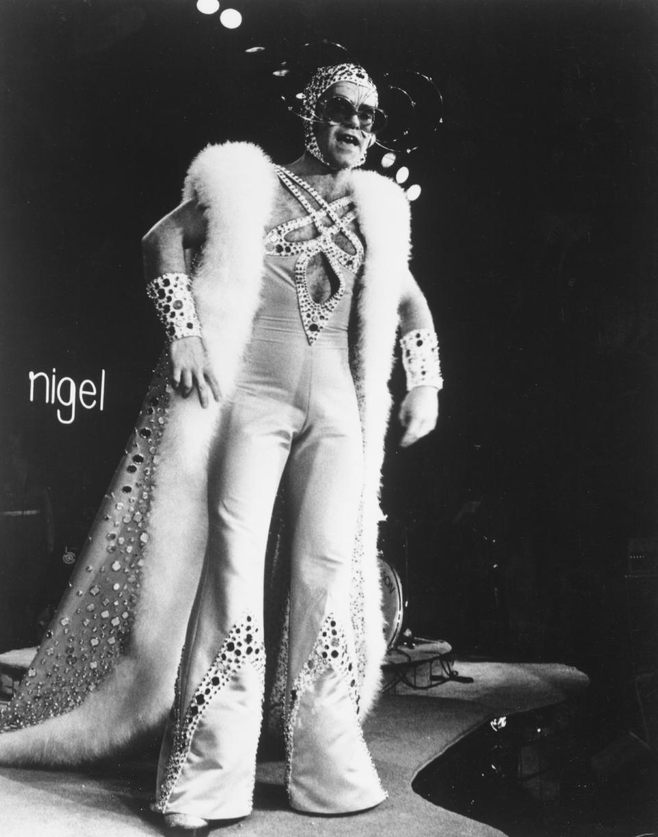 Pop singer Elton John performs "Pinball Wizard" in The Who's rock opera movie, "Tommy," which was released on March 26, 1975, in the United Kingdom.