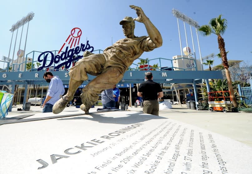 LOS ANGEL;ES, CALIFORNIA APRIL 7, 2021-A statue of baseball legend Jackie Robinson sits in the outfield.