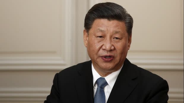 Chinese President Xi Jinping reacts during a press conference. He does not look pleased.