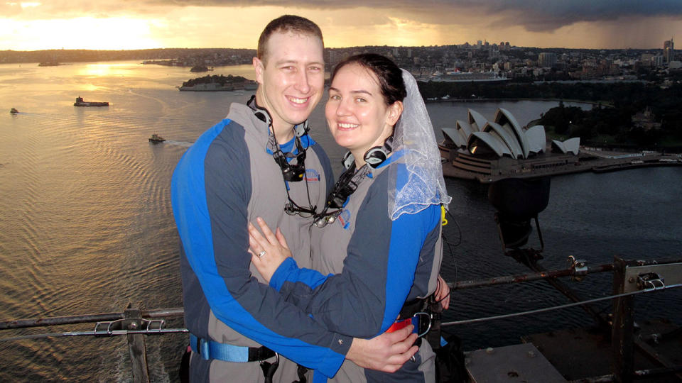 Katrina Aplitt and Cameron McCloughan pose on top of the Harbour Bridge after getting married on Valentines Day in 2012. Source: Getty Image
