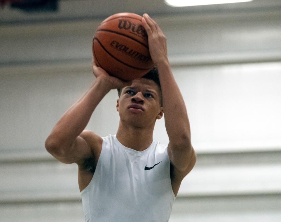 Mario Williams Jr., who plays basketball for Venture Academy in Stockton goes through some shooting drills at the school's gym on Friday, Mar. 17, 2023.