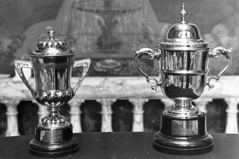 1951: The Cheltenham Gold Cup on display at the National Sporting Trophies Exhibition in Hutchinson House, London. The trophy is loaned by Dorothy Paget, owner of 'Golden Miller' who won the 3 miles 2 furlongs steeplechase in 1932 (Derek Berwin/Fox Photos/Getty Images)