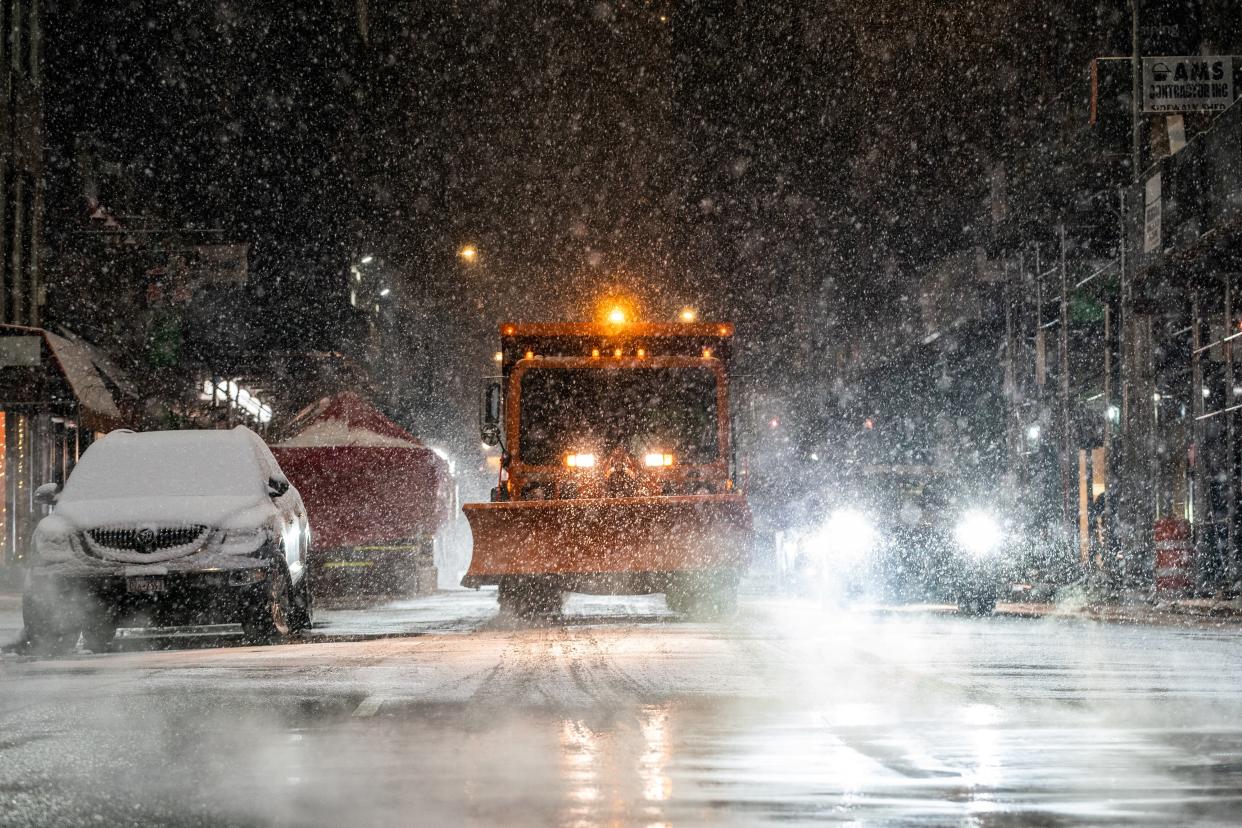<p>A snow plow is seen  as snow begins to fall in Times Square during a snow storm, during the coronavirus pandemic in the Manhattan borough of New York City, New York, on 31 January 2021</p> ((Reuters))