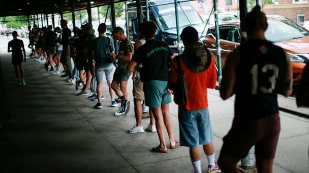 PHOTO: People wait in line to receive the Monkeypox vaccine before the opening of vaccination site at the Bushwick Education Campus in Brooklyn, July 17, 2022, in New York City. (Kena Betancur/AFP via Getty Images)