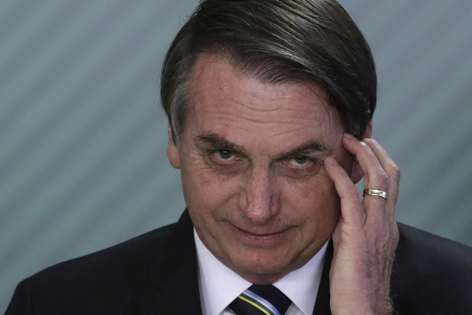 FILE - In this April 9, 2019 file photo, Brazil's President Jair Bolsonaro speaks during a swearing-in ceremony at the Planalto Presidential Palace, in Brasilia, Brazil. Bolsonaro’s latest education minister offered his resignation Tuesday, June 30, 2020, just days after his appointment, creating a new headache for the embattled leader as he struggles to start a new chapter at the ministry and shore up flagging support. (AP Photo/Eraldo Peres, File)