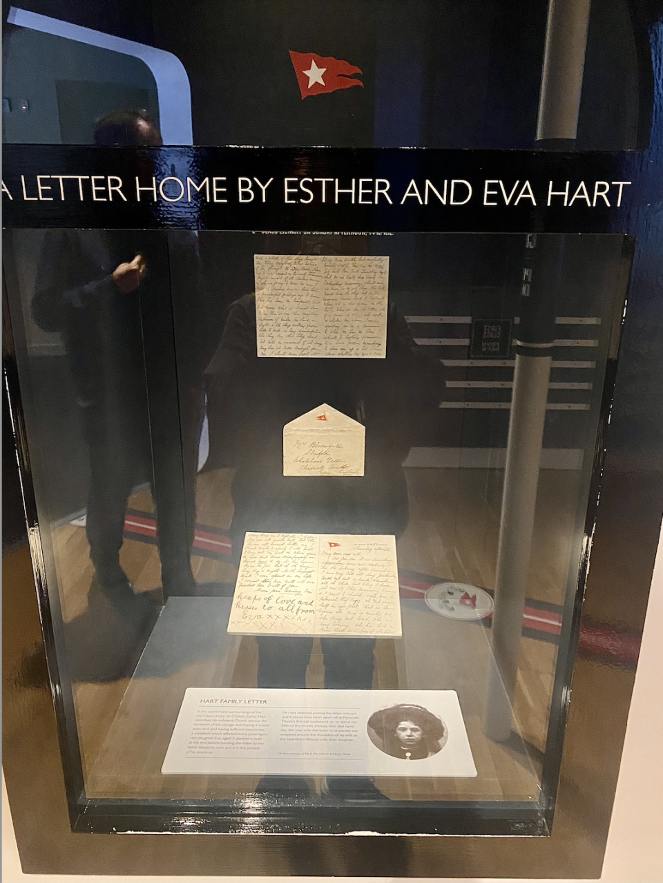 the letter on display with a photo of esther hart