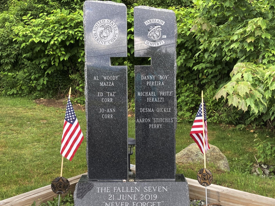 Victim names are listed on two stone pillars, part of a memorial to honor members of the Jarheads Motorcycle Club killed in a nearby crash, are visible July 13, 2022, on the roadside in Randolph, N.H. Volodymyr Zhukovskyy, of West Springfield, Mass., is scheduled to face trial on July 26, 2022, on multiple counts of negligent homicide, manslaughter, driving under the influence and reckless conduct stemming from the crash that killed seven motorcyclists that happened in Randolph on June 21, 2019. (AP Photo/Kathy McCormick)