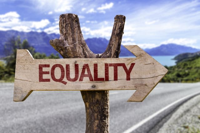 equality wooden sign with a...