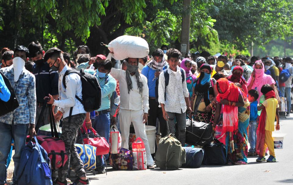 CHANDIGARH, INDIA - MAY 27: Migrants gathered to register for Shramik Special trains at Chandigarh College of Engineering and Technology (CCET) at Sector 26 on May 27, 2020 in Chandigarh, India. (Photo by Ravi Kumar/Hindustan Times via Getty Images)