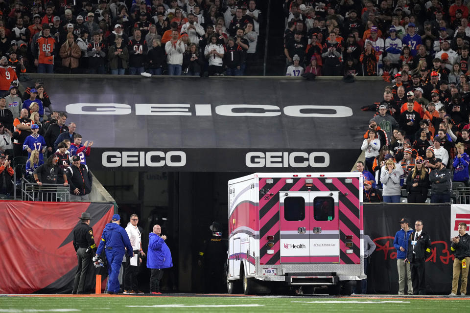 Fans look on as the ambulance leaves carrying Damar Hamlin #3 of the Buffalo Bills after he collapsed after making a tackle against the Cincinnati Bengals during the first quarter at Paycor Stadium on January 02, 2023 in Cincinnati, Ohio. (Dylan Buell / Getty Images)