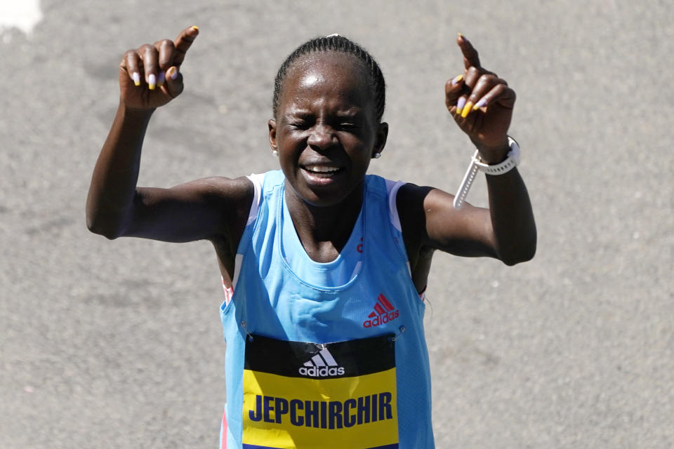 Peres Jepchirchir, of Kenya, reacts after winning the women's division of the Boston Marathon, Monday, April 18, 2022, in Boston. (AP Photo/Charles Krupa)