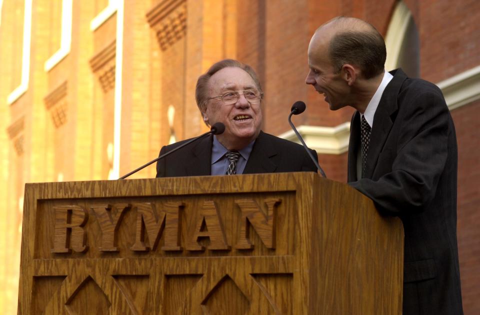 Bluegrass music legend Earl Scruggs, left, jokes with WSM country radio host Eddie Stubbs, right, before unveiling a Tennessee Historical Commission historical marker Friday, Sept. 29, 2006, commemorating the birth of bluegrass music at the Ryman Auditorium in Nashville, Tenn. (AP Photo/Christopher Berkey)