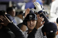 New York Yankees' Anthony Rizzo is congratulated after hitting a two-run home run against the Toronto Blue Jays during the sixth inning of a baseball game Thursday, Sept. 9, 2021, in New York. (AP Photo/Adam Hunger)