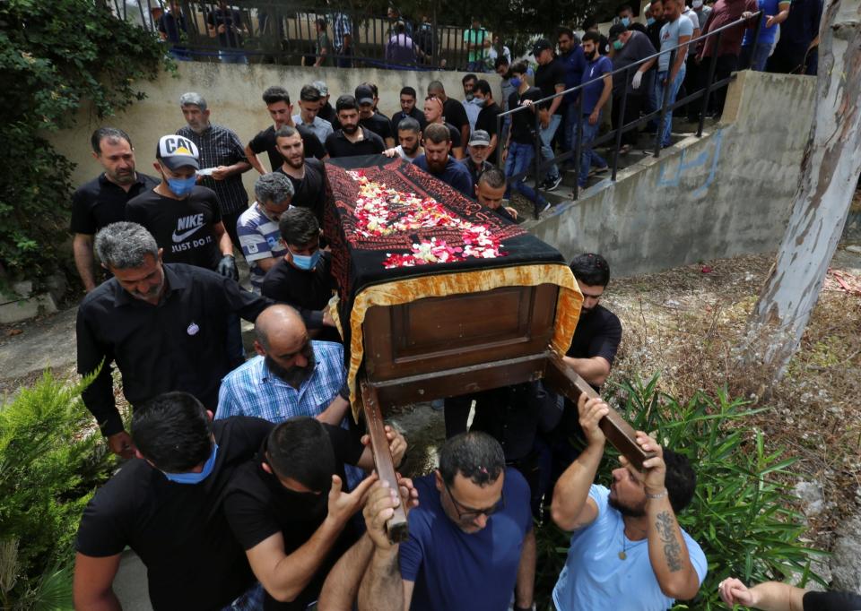 Relatives of Aya Hachem carry her coffin during the funeral at a cemetery in her family's hometown of Qlaileh (REUTERS)