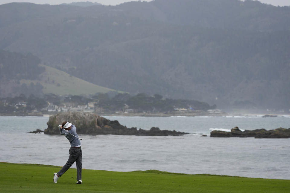 Keith Mitchell hits from the 18th fairway at Pebble Beach Golf Links during the third round of the AT&T Pebble Beach National Pro-Am golf tournament in Pebble Beach, Calif., Saturday, Feb. 3, 2024. (AP Photo/Ryan Sun)