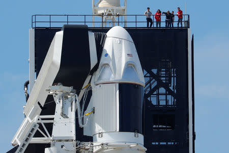 A SpaceX Falcon 9 carrying the Crew Dragon spacecraft sits on launch pad 39A prior to the uncrewed test flight to the International Space Station from the Kennedy Space Center in Cape Canaveral, Florida, U.S., March 1, 2019. REUTERS/Mike Blake