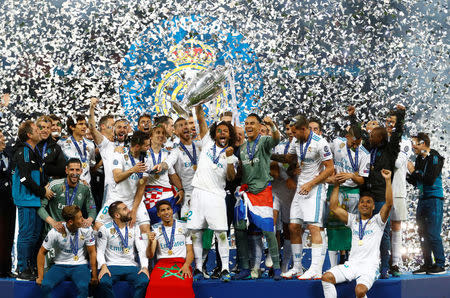 Soccer Football - Champions League Final - Real Madrid v Liverpool - NSC Olympic Stadium, Kiev, Ukraine - May 26, 2018 Real Madrid celebrate winning the Champions League with the trophy REUTERS/Kai Pfaffenbach