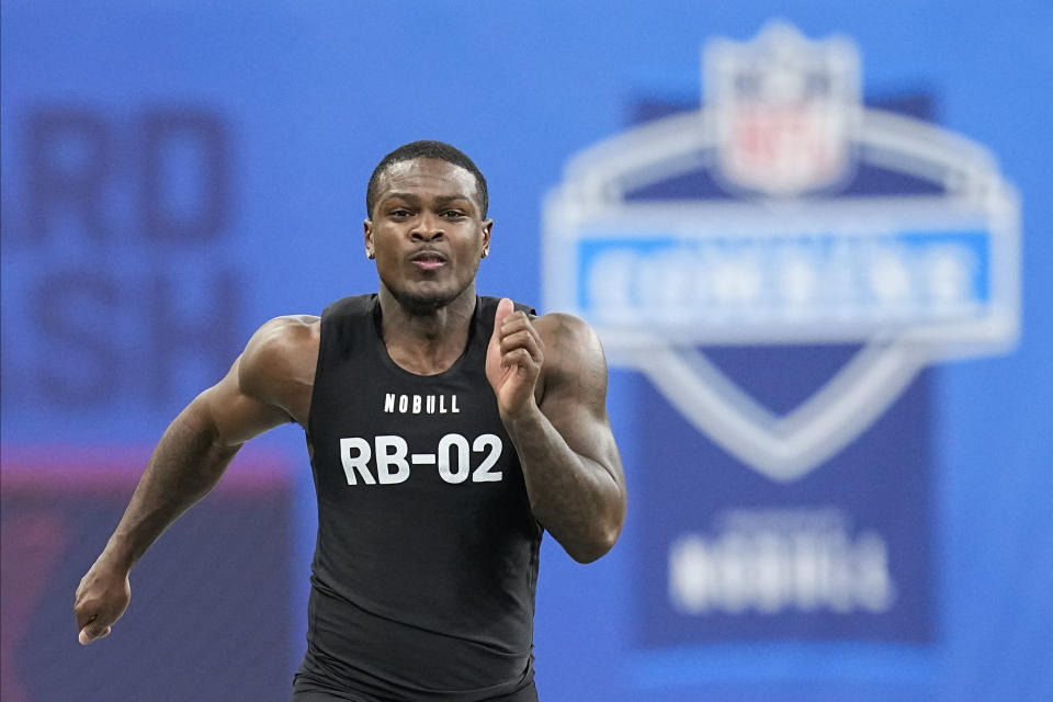 FILE - Texas A&M running back Devon Achane runs the 40-yard dash at the NFL football scouting combine in Indianapolis, Sunday, March 5, 2023. The NFL Draft begins Thursday, April 27 in Kansas City, Mo. (AP Photo/Darron Cummings, File)