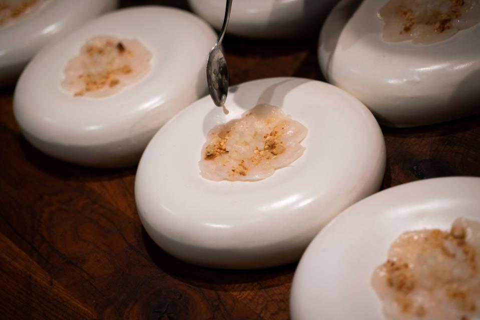 A scallop crude ssam with brown butter and Korean pear is prepared during Tablescape, a dinner that merges art and food, at Marrow in Detroit on Friday, Sept. 8, 2023.