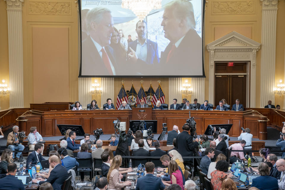 A image of former President Donald Trump talking to his Chief of Staff Mark Meadows is seen as Cassidy Hutchinson, former aide to Trump White House chief of staff Mark Meadows, testifies as the House select committee investigating the Jan. 6 attack on the U.S. Capitol holds a hearing at the Capitol in Washington, Tuesday, June 28, 2022. (Sean Thew/Pool via AP)