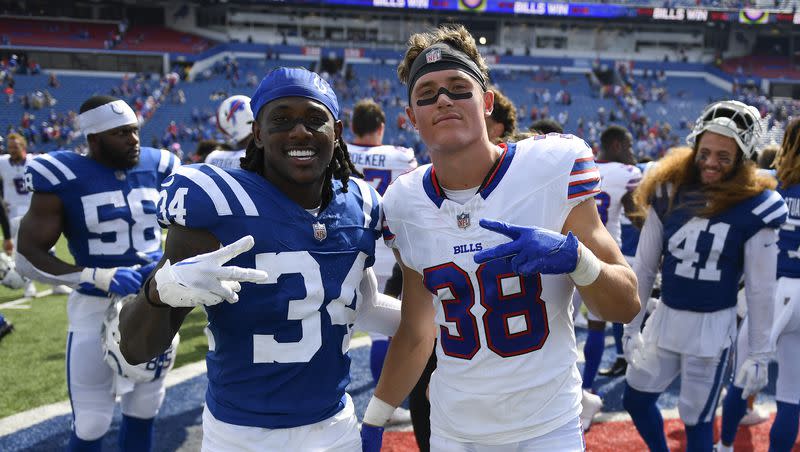 Indianapolis Colts defensive back Chris Lammons, left, and Buffalo Bills safety Zayne Anderson pose for a photo after an NFL preseason football game in Orchard Park, N.Y., Saturday, Aug. 12, 2023. On Wednesday, the former BYU star was plucked off the waiver wire by the Green Bay Packers.