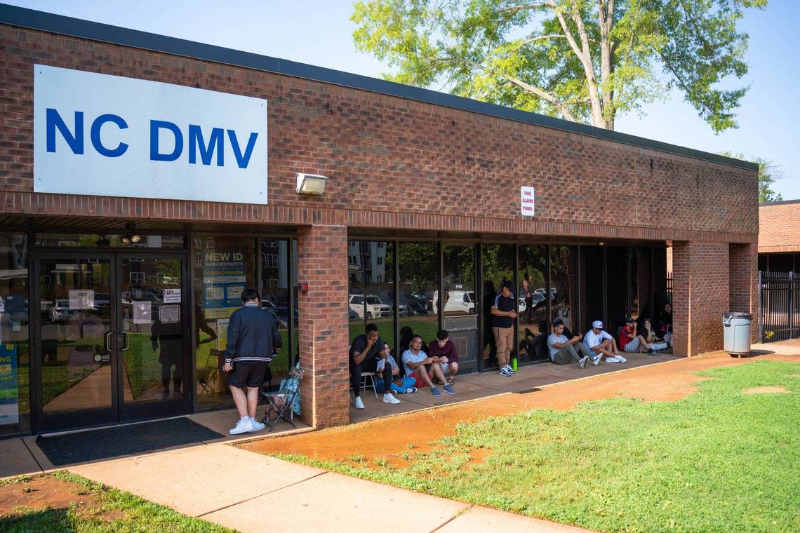 People wait outside the NCDMV office in east Charlotte on Wednesday.