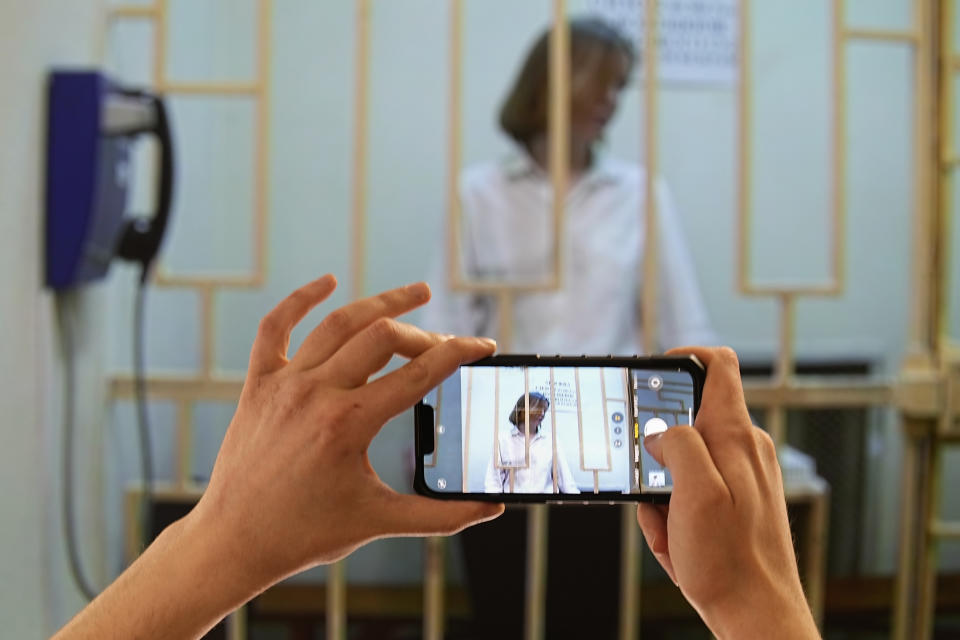 Darya Trepova, a suspect in a bombing that killed a well-known Russian military blogger, appears in a video link in a courtroom during a hearing at the Moscow City Court in Moscow, Russia, Monday, April 24, 2023. The court rejected Trepova's appeal against her arrest on charges of involvemt in the April 2 bombing that killed Vladlen Tatarsky and injured 50 others at a St. Petersburg cafe. (AP Photo/Alexander Zemlianichenko, Pool)