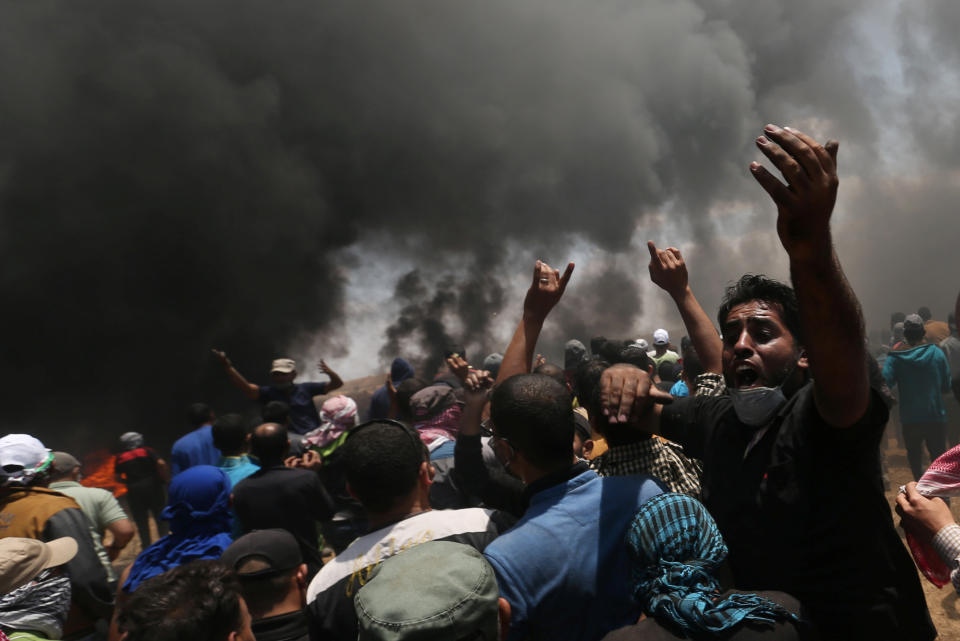 Palestinians protest along the Israel-Gaza border, where Israeli forces killed dozens. (Photo: Ibraheem Abu Mustafa/Reuters)