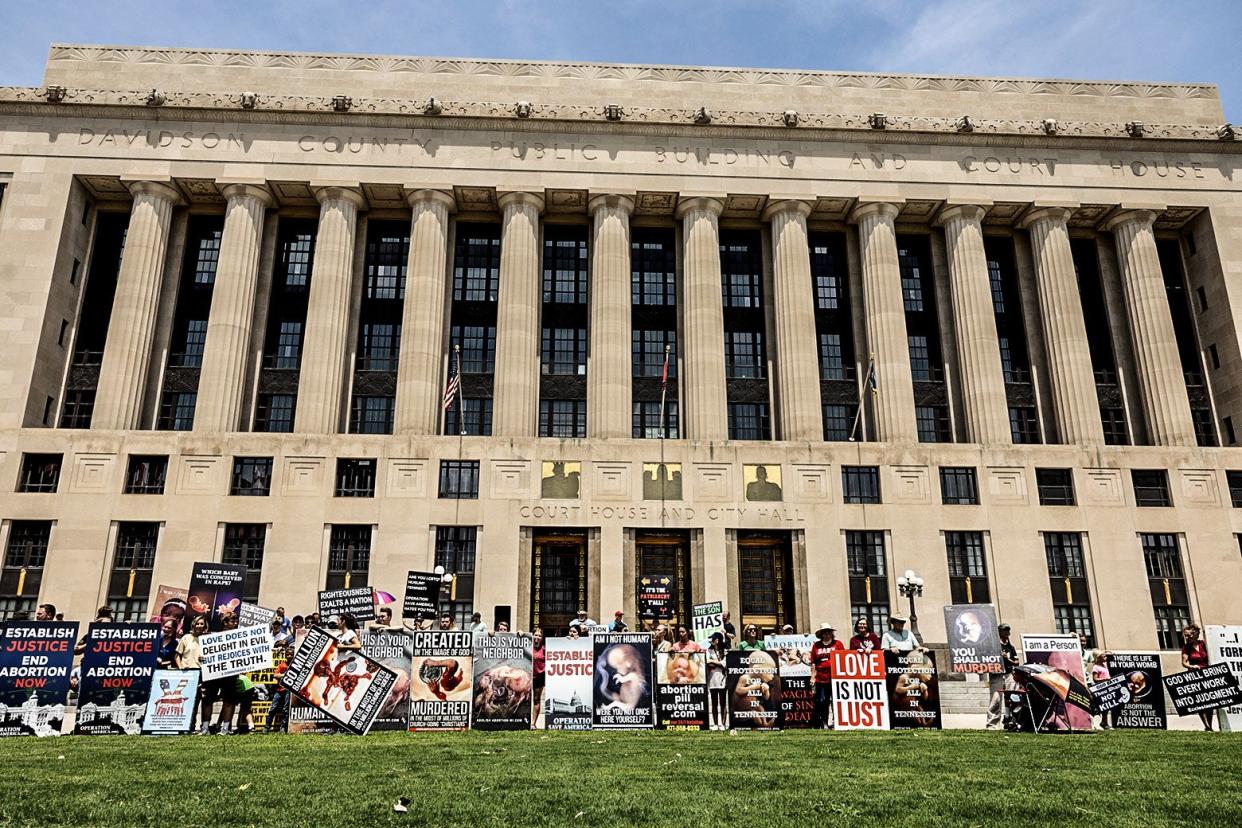 Protesters hold up signs that read "Love is not Lust" and the like.