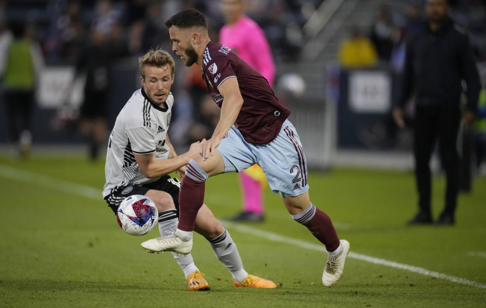 Colorado Rapids defender Keegan Rosenberry, right, pursues the ball with San Jose Earthquakes midfielder Jackson Yueill, left, in the first half of an MLS soccer match Saturday, June 3, 2023, in Commerce City, Colo. (AP Photo/David Zalubowski)