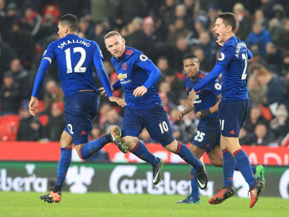 Wayne Rooney celebrates scoring his club-record 250th goal for Manchester United: Getty