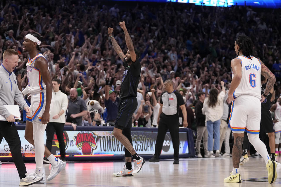 Dallas Mavericks' Derrick Jones Jr., center, celebrates the team's win as Oklahoma City Thunder's Shai Gilgeous-Alexander, left, and Jaylin Williams walk away following Game 6 of an NBA basketball second-round playoff series Saturday, May 18, 2024, in Dallas. (AP Photo/Tony Gutierrez)