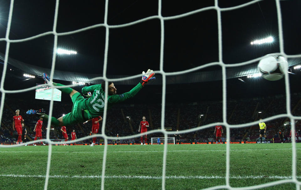 KHARKOV, UKRAINE - JUNE 17: Rui Patricio of Portugal dives as he attempts to stop Rafael van der Vaart (not pictured) of Netherlands scoring the opening goal past during the UEFA EURO 2012 group B match between Portugal and Netherlands at Metalist Stadium on June 17, 2012 in Kharkov, Ukraine. (Photo by Ian Walton/Getty Images)