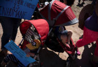 People participate in a protest against a recent U.S. immigration policy of separating children from their families when they enter the United States as undocumented immigrants, outside the Tornillo Tranit Centre, in Tornillo, Texas, U.S., June 17, 2018. REUTERS/Monica Lozano