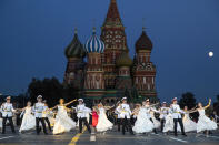 <p>Russian military band participants perform during a rehearsal of the Spasskaya Tower international military music festival in Red Square, in Moscow, Russia, late Thursday, Aug. 23, 2018, with the Saint Basil’s Cathedral in the background. (AP Photo/Pavel Golovkin) </p>