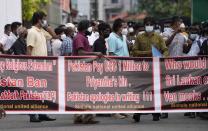 Members of Sri Lankan civil society organisations protest demanding justice for the Sri Lankan employee who has been lynched by Muslim mob in Sialkot last week outside Pakistani high commission in Colombo, Sri Lanka, Monday, Dec. 6, 2021. (AP Photo/Eranga Jayawardena)