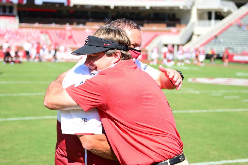 Georgia head coach Kirby Smart greets Arkansas head coach Sam Pittman before the Bulldogs' game with Arkansas in Fayetteville, Ark., on Sept. 26, 2020. (Photo by Kevin Snyder)