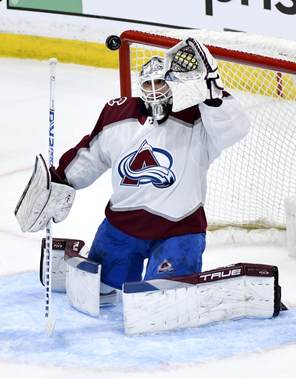 Colorado Avalanche goaltender Alexandar Georgiev (40) makes a save on a Winnipeg Jets shot during the second period in Game 5 of an NHL hockey Stanley Cup first-round playoff series in Winnipeg, Manitoba, Tuesday April 30, 2024. (Fred Greenslade/The Canadian Press via AP)