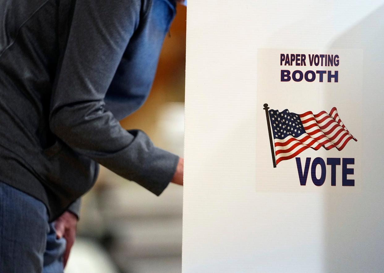 A voter makes his picks on primary Election Day at Grove City Recreation Center in Grove City, Ohio on May 3, 2022. 