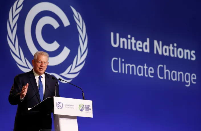 Al Gore speaks at a podium during a news conference at the United Nations Climate Change Conference.