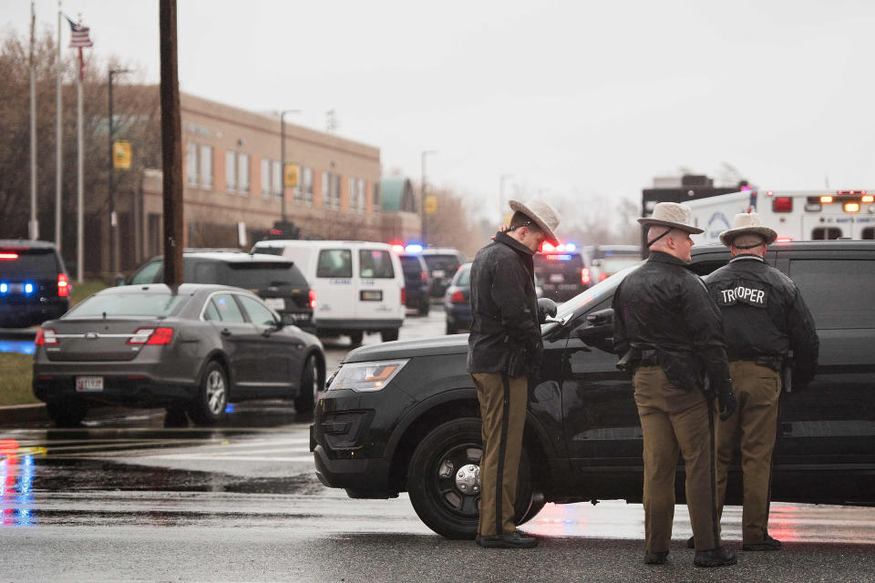 Maryland State Troopers gather on March 20, 2018 at Great Mills High School in Great Mills, Maryland after a shooting at the school.