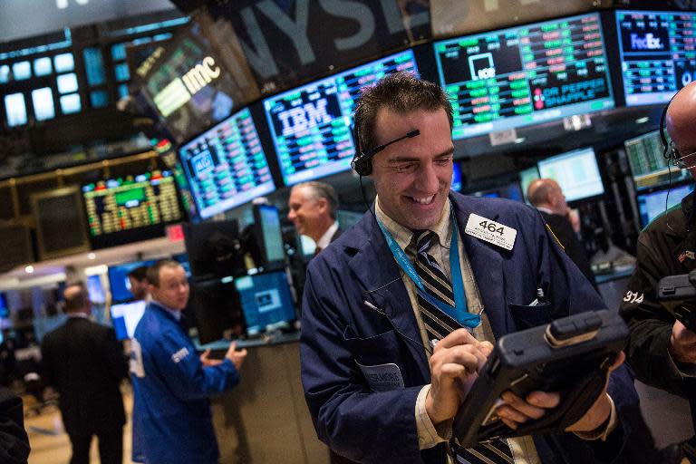 A trader works on the floor of the New York Stock Exchange during the afternoon of March 30, 2015